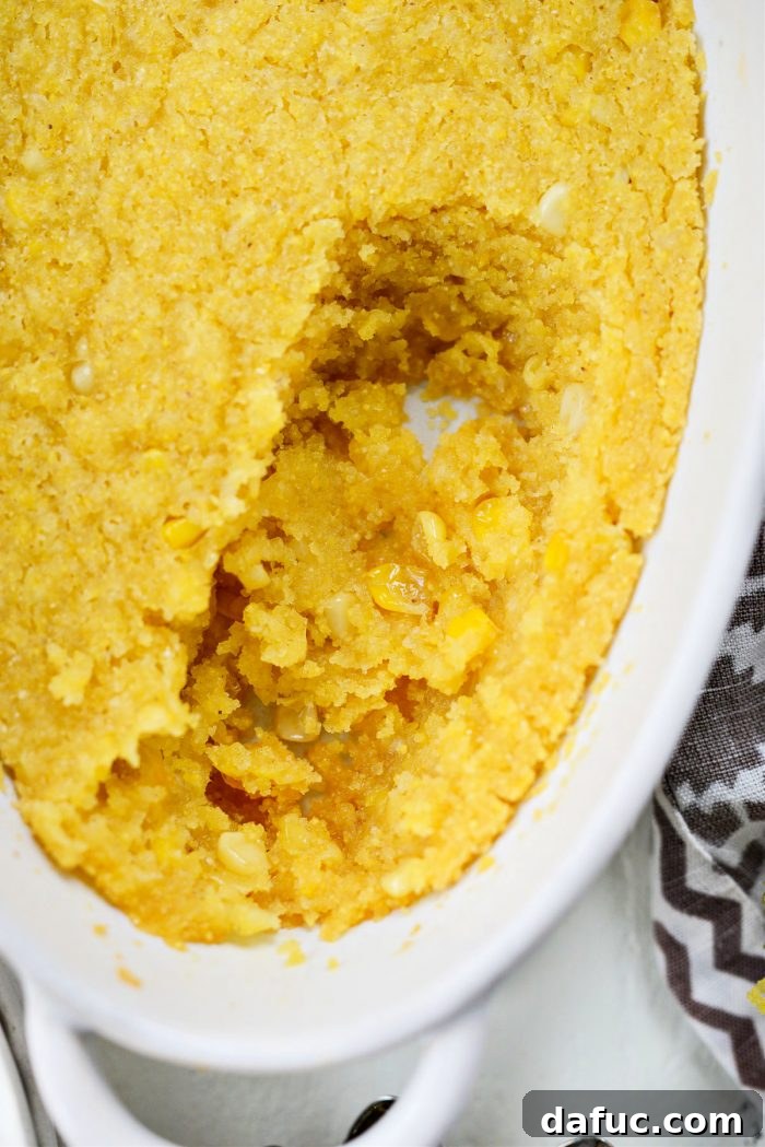 Sweet Mexican Cornbread 14 Close-up of a scooped portion of Mexican Sweet Corn Cake, emphasizing its fluffy and moist interior