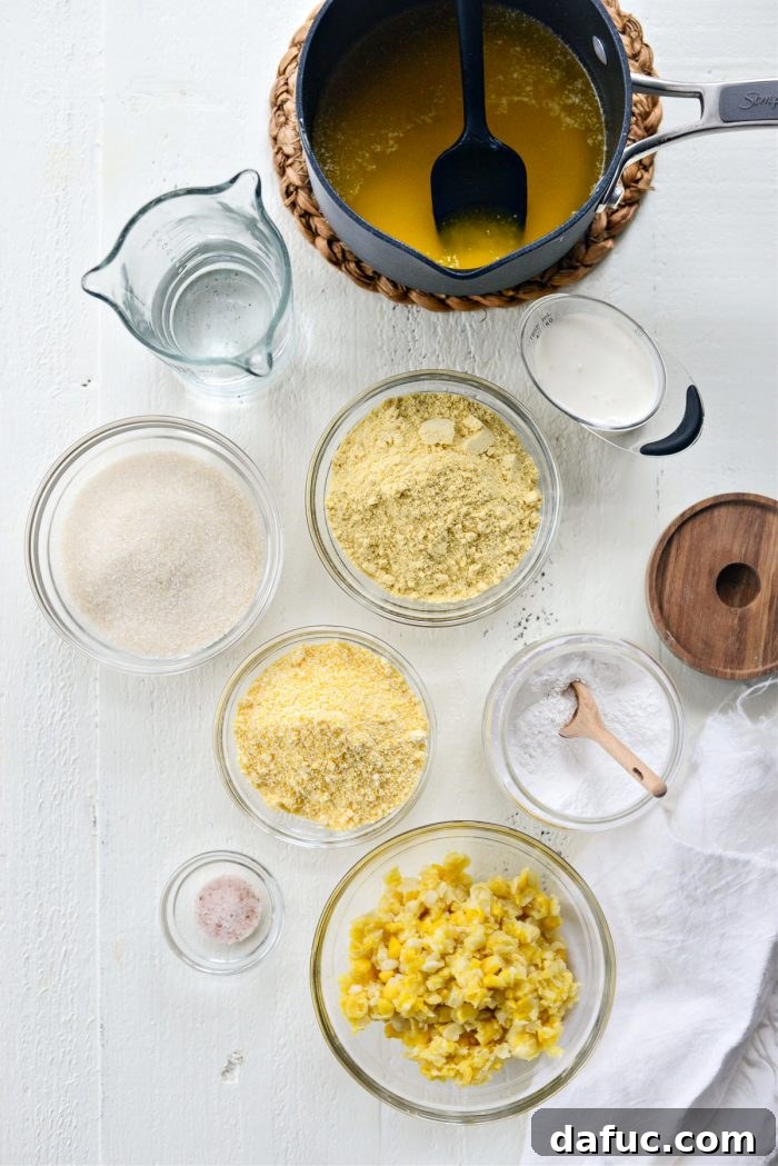 Sweet Mexican Cornbread 4 A collection of ingredients laid out, including masa harina, cornmeal, sugar, baking powder, salt, sweet corn, butter, water, and heavy cream
