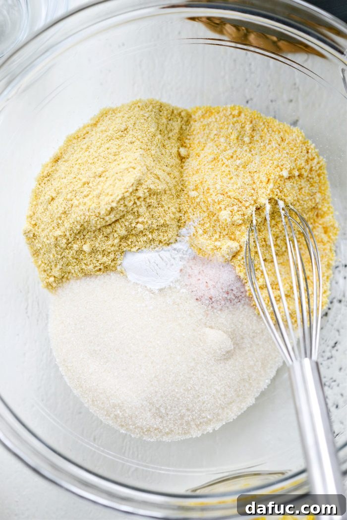 Sweet Mexican Cornbread 5 Dry ingredients including masa harina, cornmeal, sugar, baking powder, and salt in a large mixing bowl