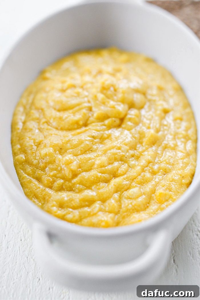 Sweet Mexican Cornbread 10 The mixed corn cake batter being poured into an ungreased 2-quart oven-safe baking dish