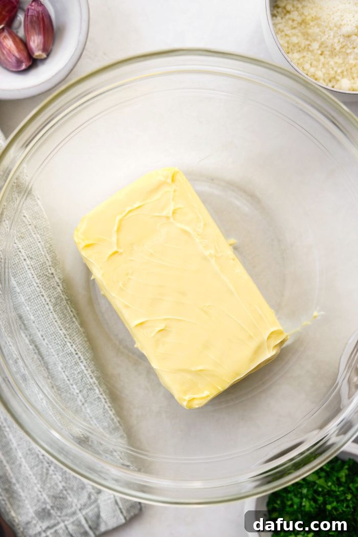 Aromatic Garlic Parmesan Bread 6 Softened unsalted butter added to a bowl