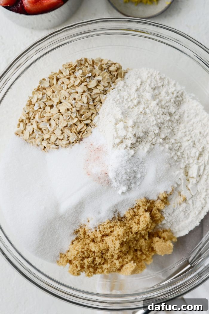 Bowl with old fashioned oats, all-purpose flour, white and brown sugars, baking soda, baking powder, and fine salt