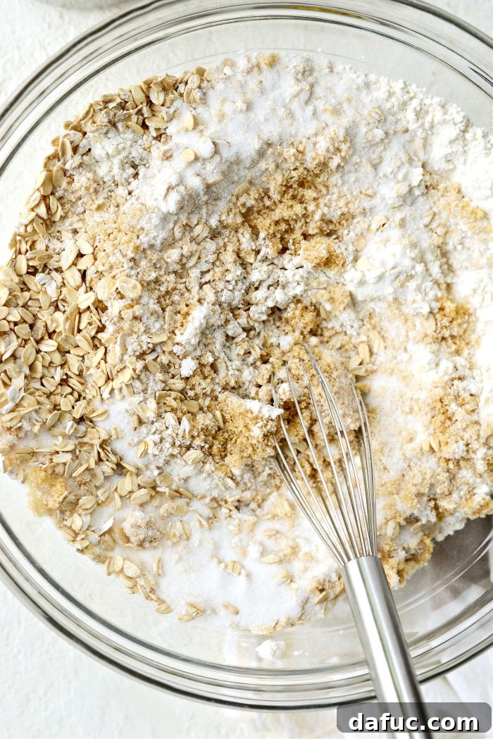Whisking dry ingredients in a large bowl for streusel bars