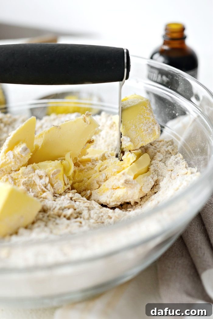 Using a pastry blender to cut butter into dry ingredients for streusel