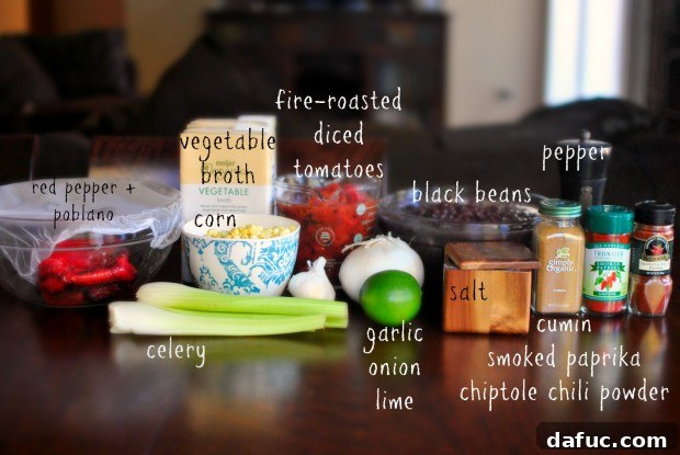 Fresh ingredients for Black Bean and Corn Soup, including peppers, beans, and spices