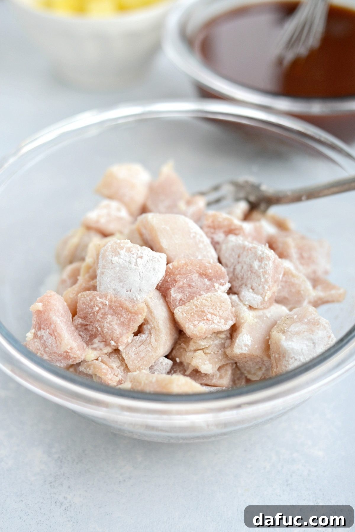 diced chicken tossed and coated with cornstarch and white pepper