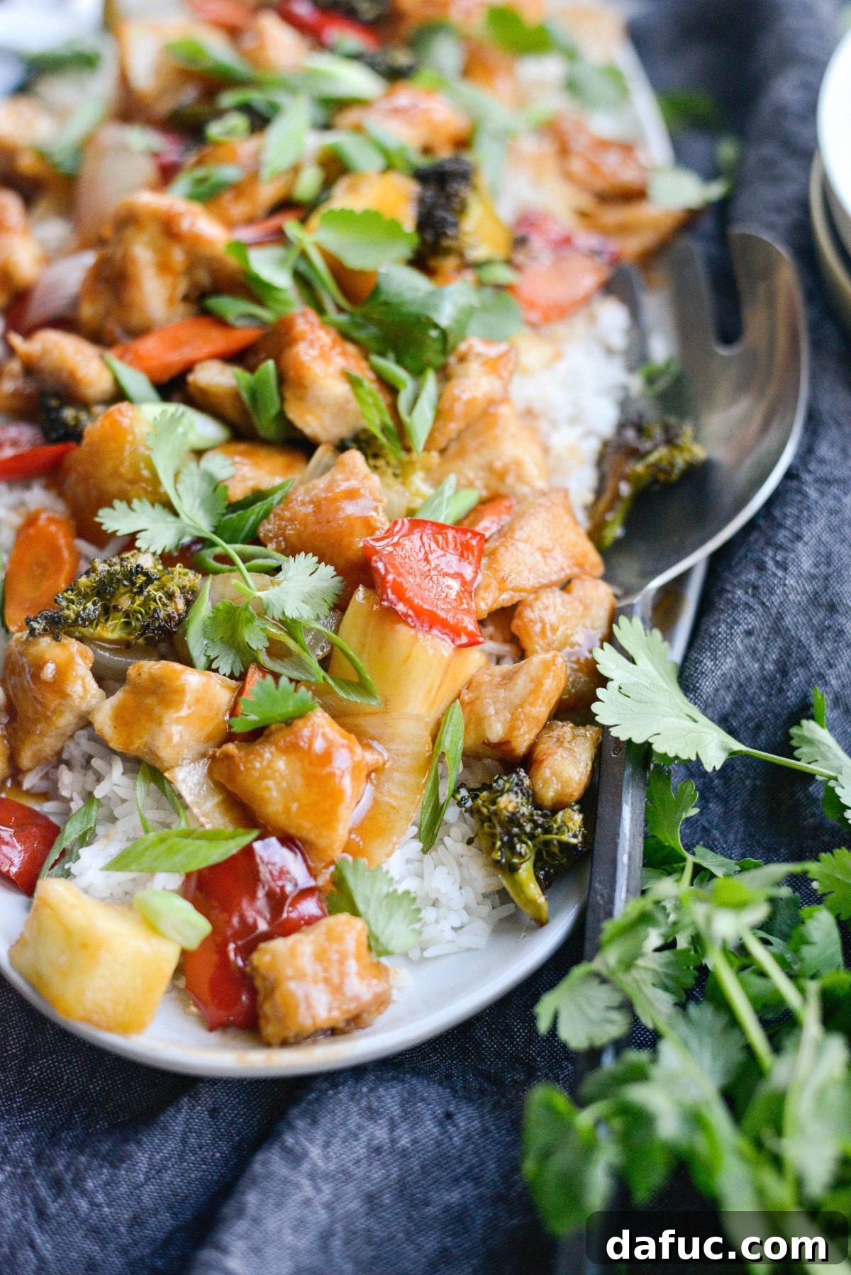 close up of Homemade Sweet and Sour Chicken on white platter