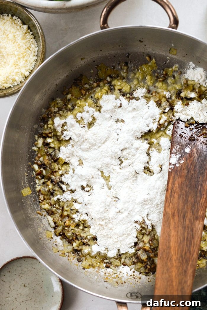 Crispy Shallot Green Bean Casserole 16 Flour sprinkled over the vegetable mixture in the skillet, forming a roux.