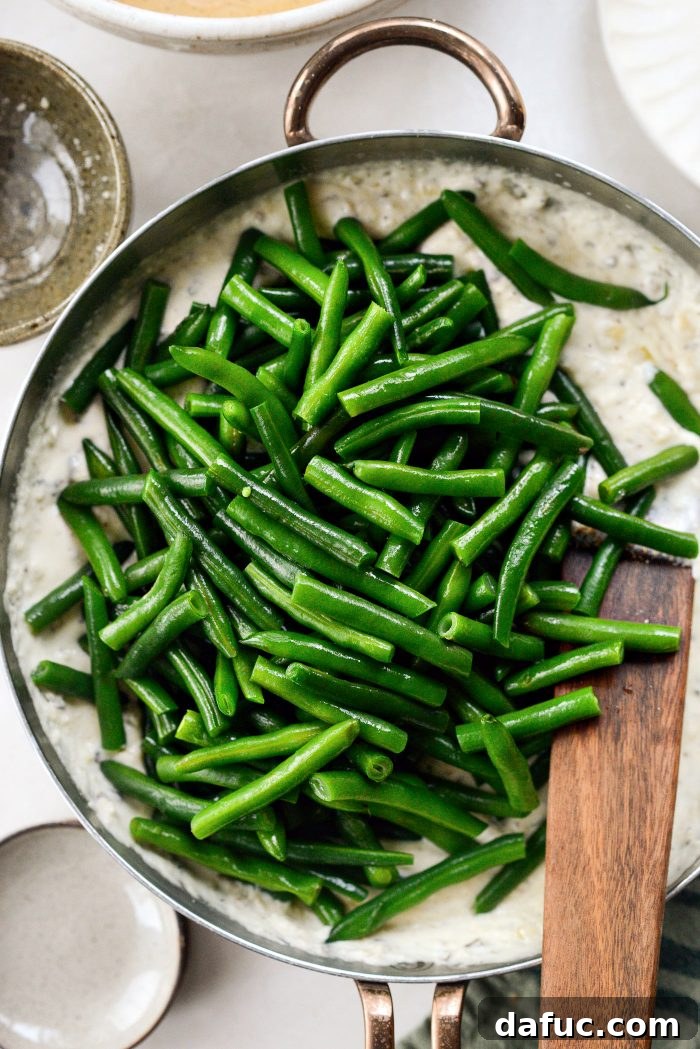 Crispy Shallot Green Bean Casserole 20 The blanched and cut green beans added to the creamy sauce in the skillet.