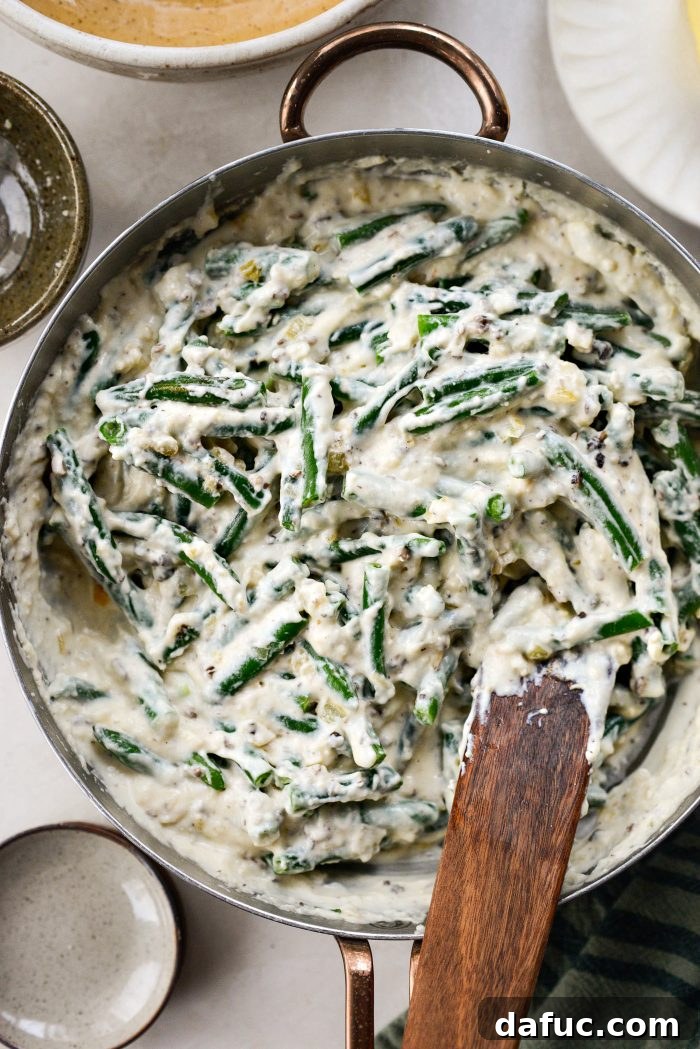 Crispy Shallot Green Bean Casserole 21 Green beans being tossed and coated in the creamy mushroom sauce.