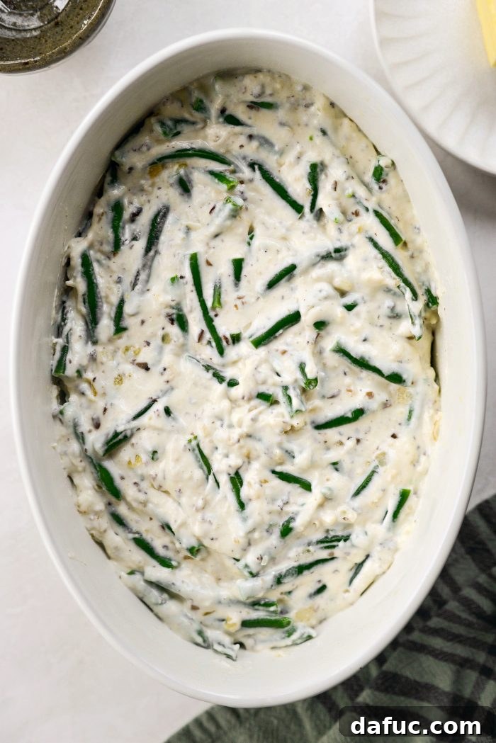 Crispy Shallot Green Bean Casserole 22 The green bean casserole mixture transferred to the dish, covered with foil, and ready for baking.