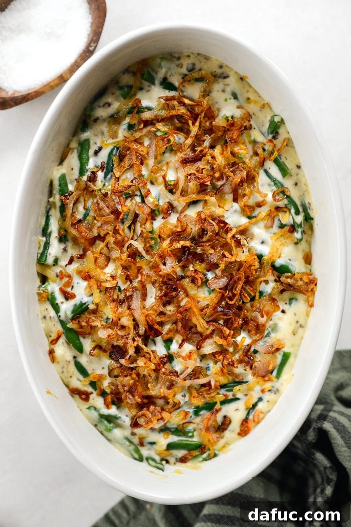 Crispy Shallot Green Bean Casserole 25 Crispy fried shallots sprinkled over the partially baked green bean casserole, ready to return to the oven.