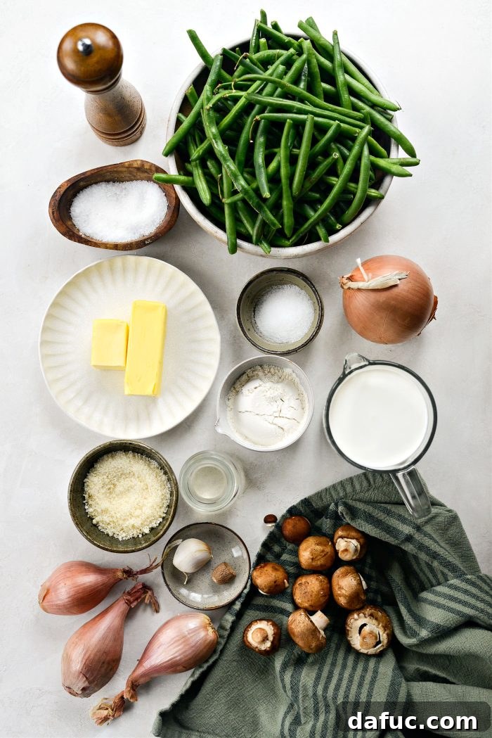 Crispy Shallot Green Bean Casserole 4 A flat lay image displaying all the fresh ingredients needed for Homemade Green Bean Casserole with Fried Shallots.