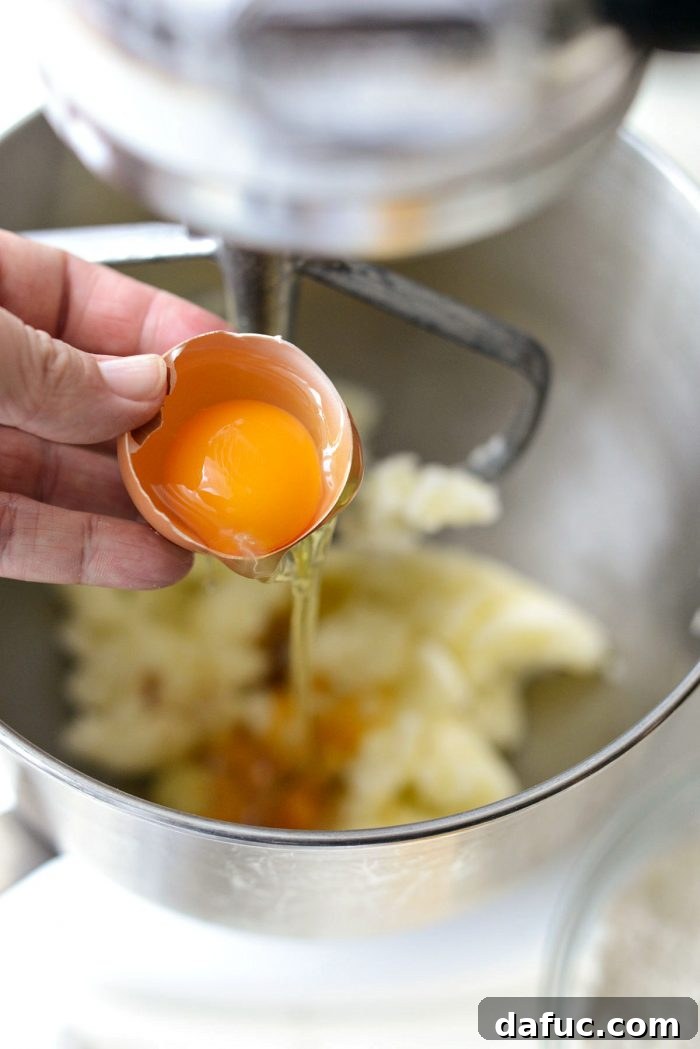 Martha Sweet Rhubarb Flip 18 Adding one egg at a time to the cake batter in a stand mixer
