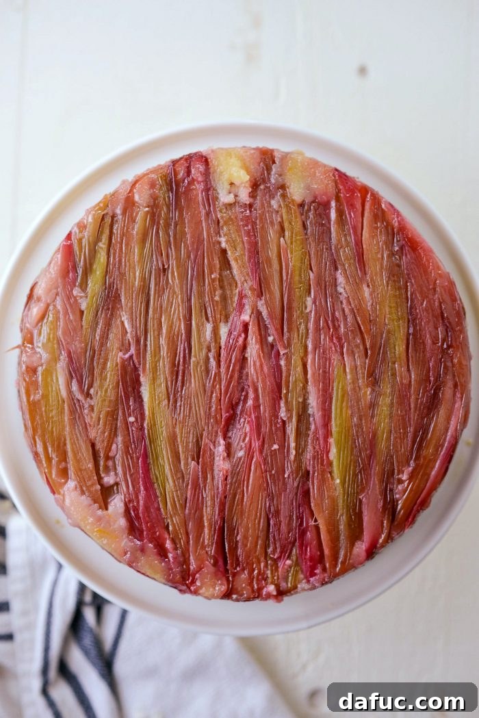 Martha Sweet Rhubarb Flip 26 Carefully inverting Martha's Rhubarb Upside Down Cake onto a white cake stand
