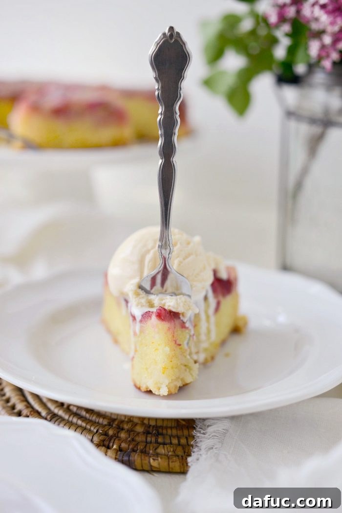 Martha Sweet Rhubarb Flip 30 A full Martha's Rhubarb Upside Down Cake on a white pedestal cake plate, ready to be served