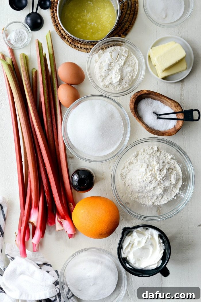 Martha Sweet Rhubarb Flip 4 Various baking ingredients laid out on a white background, including flour, sugar, butter, and rhubarb