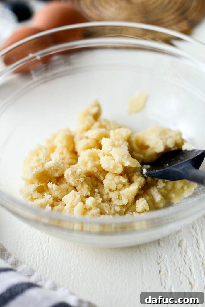 Martha Sweet Rhubarb Flip 6 Crumb topping mixture resting in a clear bowl, showing its clumpy texture