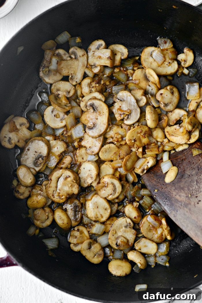 Hearty Homestyle Beef Stroganoff 14 Mushrooms and onions cooking until softened