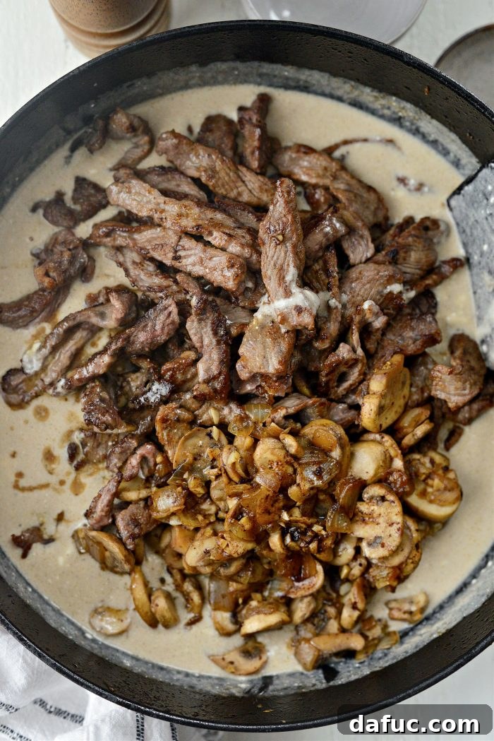 Hearty Homestyle Beef Stroganoff 23 Adding seared beef and sautéed mushrooms to the creamy Stroganoff sauce