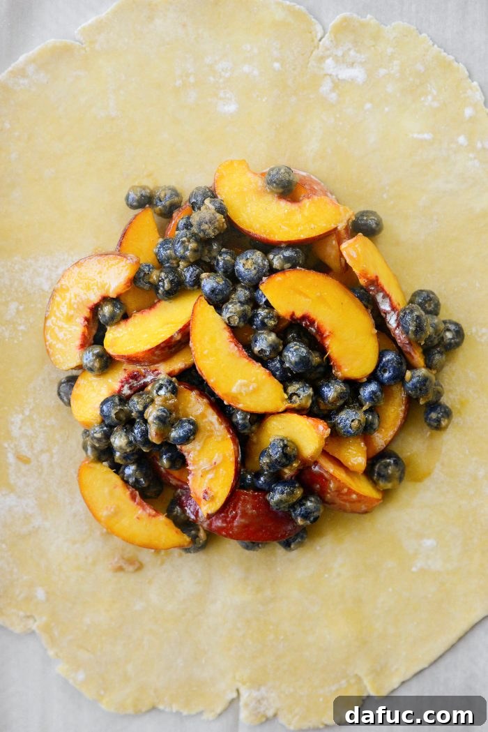 Rustic Peach and Blueberry Galette 8 add filling into center of dough