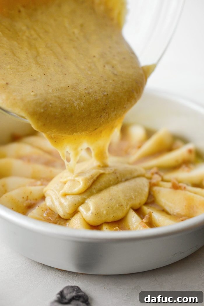 Caramelized Ginger Pear Invert 20 Pouring cake batter over pears