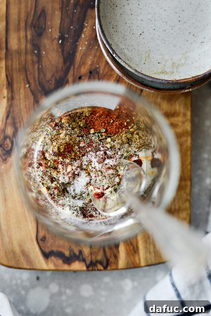 Mixing the dry spices for homemade taco seasoning until combined