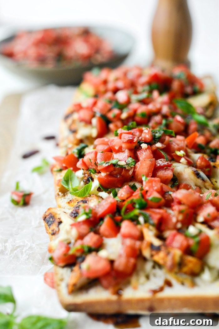 Vibrant Bruschetta Chicken Pizza 16 A slice of Grilled Chicken Bruschetta Pizza showcasing layers of chicken, cheese, and bruschetta