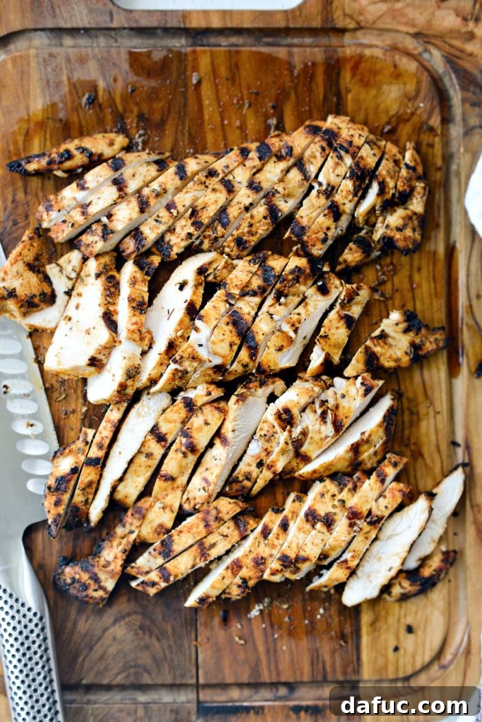 Vibrant Bruschetta Chicken Pizza 8 Thinly sliced grilled chicken breast arranged on a cutting board