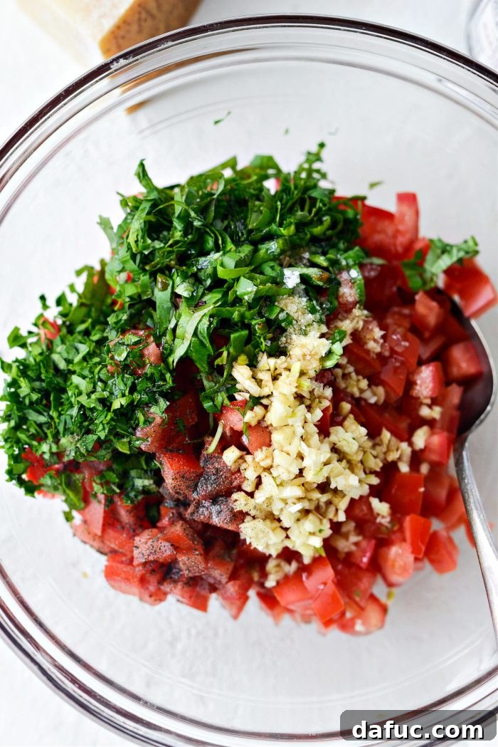 Vibrant Bruschetta Chicken Pizza 9 Fresh bruschetta topping ingredients in a bowl before being mixed