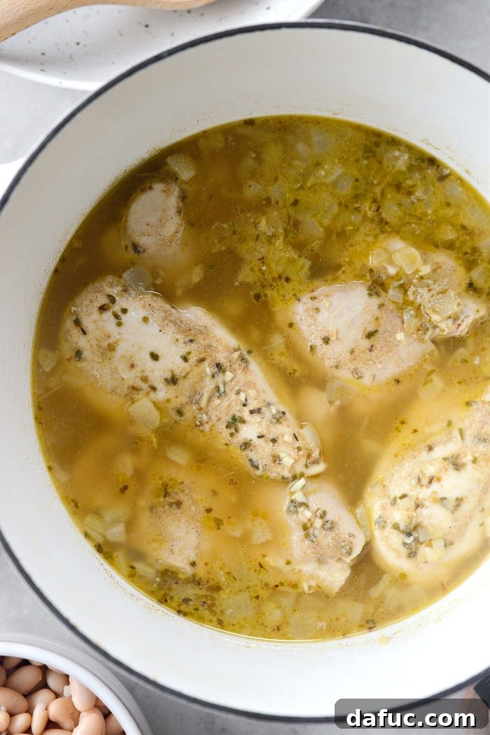 Velvety White Chicken Chili 11 poached chicken
