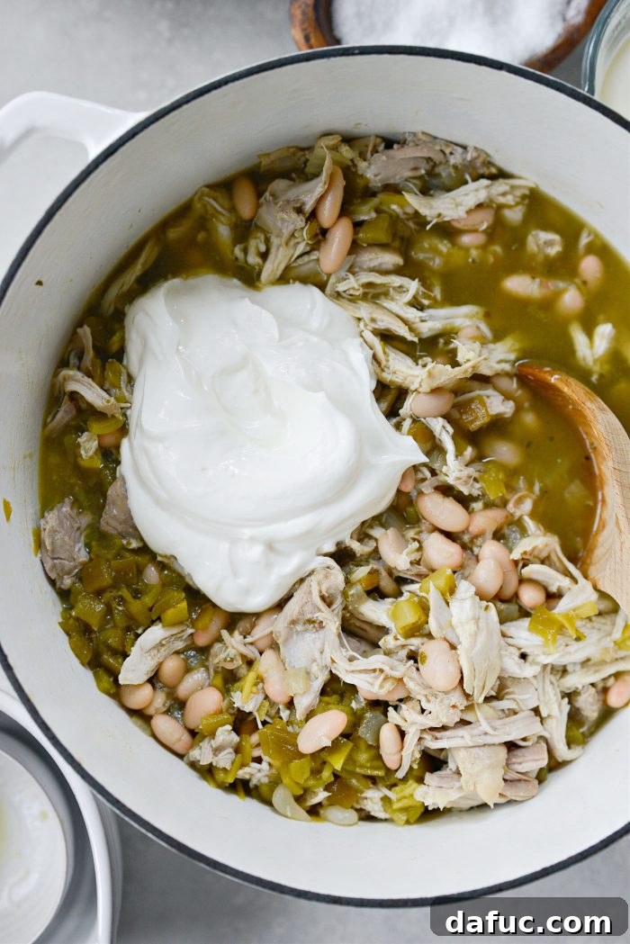 Velvety White Chicken Chili 15 Add in sour cream