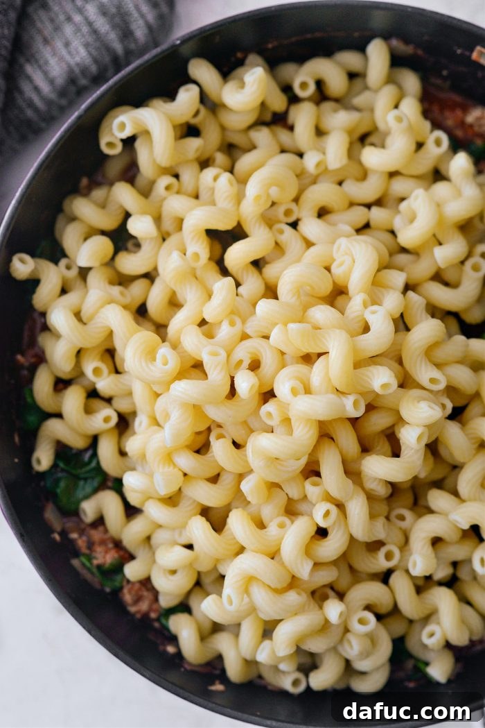 drop in the cooked pasta