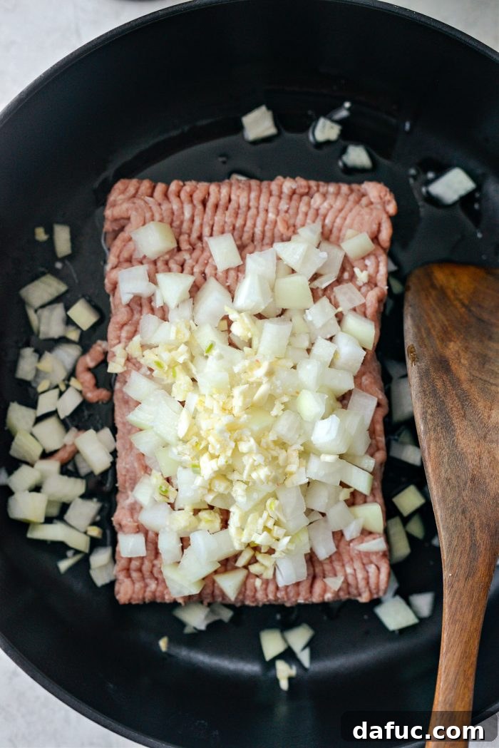 add ground turkey, onions and garlic to deep skillet