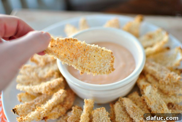 Golden Baked Onion Blooms with Zesty Fry Dip 16 Picking an onion petal