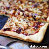 Hunter's Barbecue Pheasant Pizza 2 Delicious Barbecue Pheasant Pizza slice.