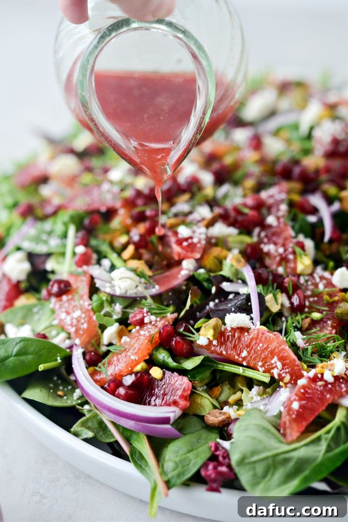 Vibrant Blood Orange Pistachio Feta Salad 11 pour the orange dressing over top.