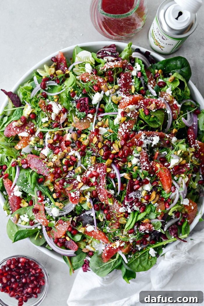 Vibrant Blood Orange Pistachio Feta Salad 10 Top with micro greens, red onion, orange segments, crumbled feta, chopped pistachios, pomegranate arils and chopped fresh dill.
