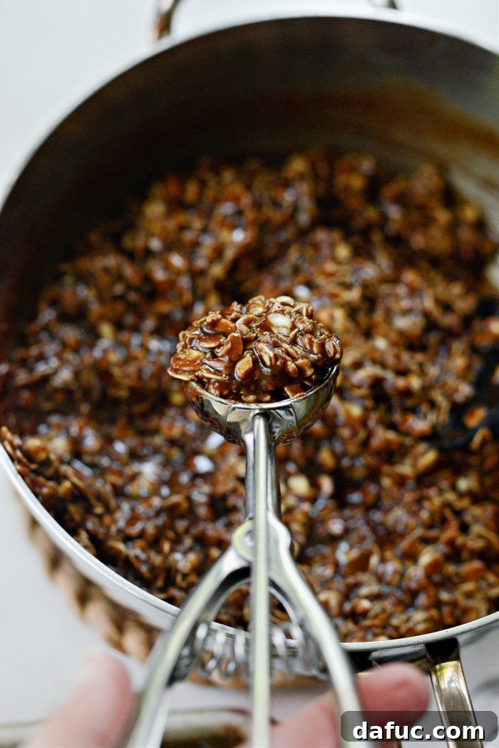 Fudgy No-Bake Oatmeal Delights 11 Scooping rounded mounds of chocolate oatmeal cookie mixture onto a lined pan