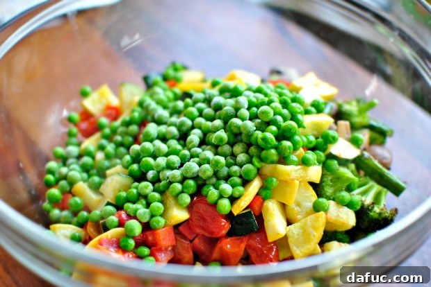 Golden Roasted Vegetable Primavera Pasta 14 Adding peas to the vegetable mix