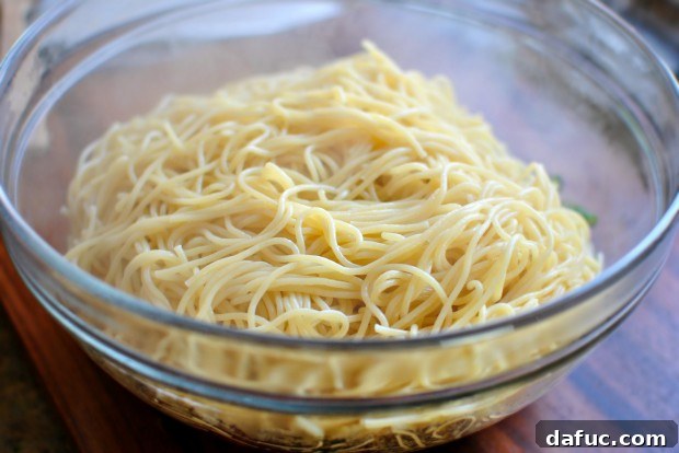 Golden Roasted Vegetable Primavera Pasta 15 Adding cooked pasta to the vegetables