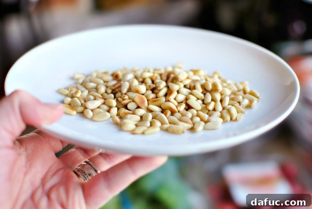 Golden Roasted Vegetable Primavera Pasta 5 Removing toasted pine nuts