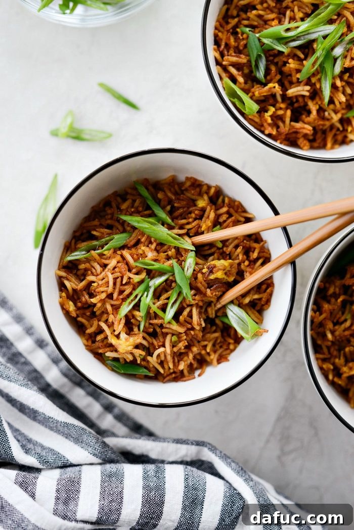 Effortless Fried Rice 13 Easy Fried Rice plated in bowls and garnished with fresh dark green onions