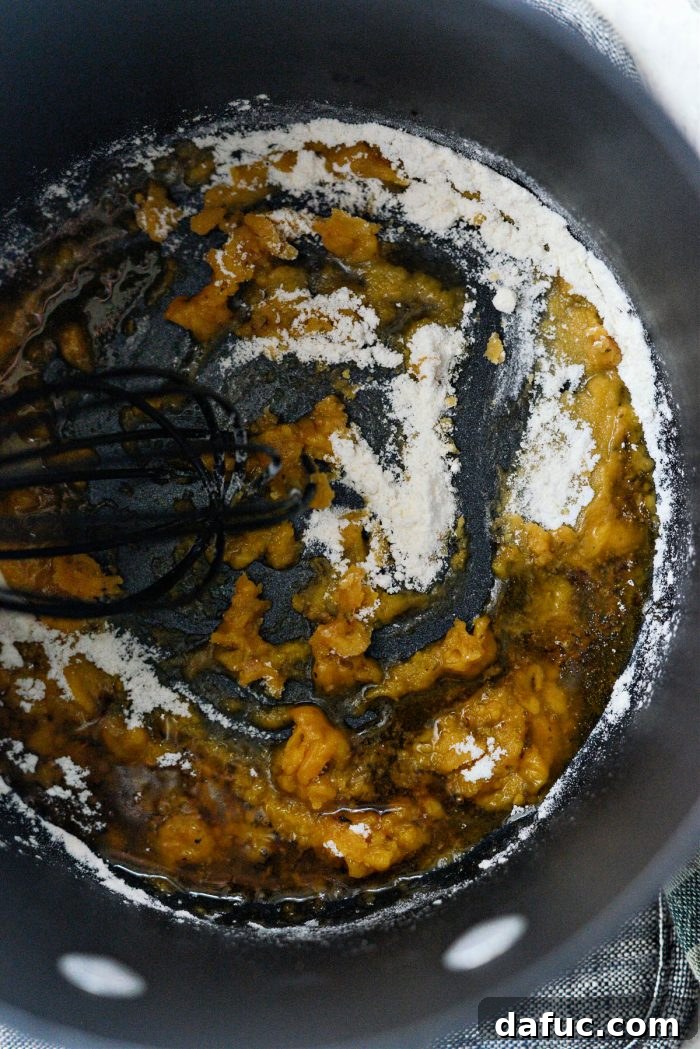 Classic Comfort Baked Chicken 21 Whisking flour into hot drippings in a saucepan