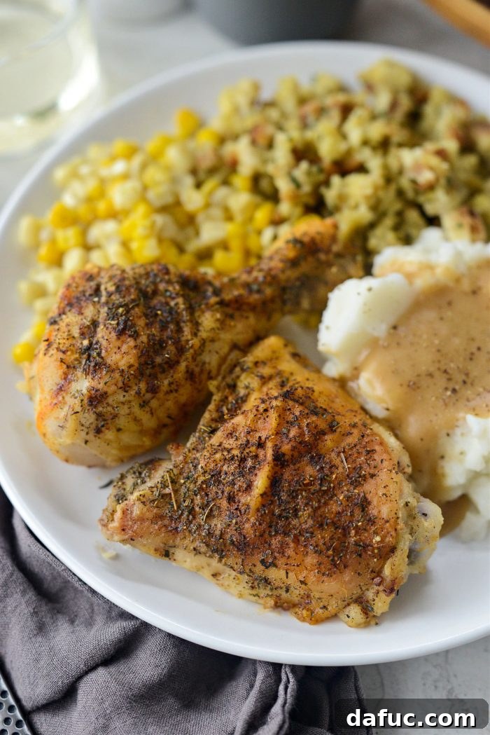 Classic Comfort Baked Chicken 24 Homestyle Baked Chicken with Gravy, mashed potatoes, and corn on a plate