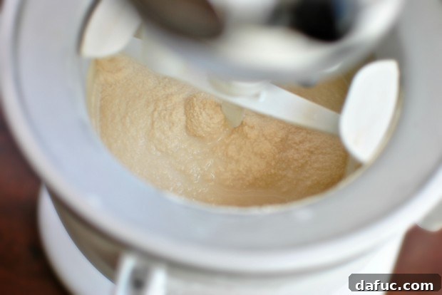 Churned ice cream base showing thick, semi-frozen consistency