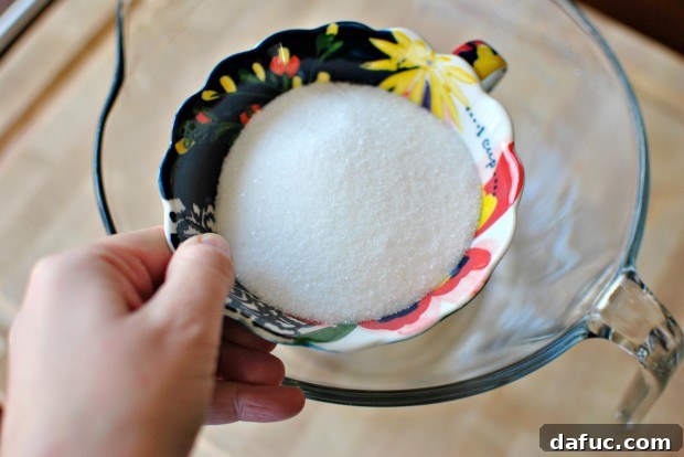 Measuring white sugar for coffee ice cream