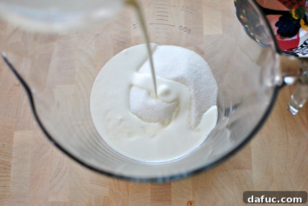 Adding heavy cream to the sugar