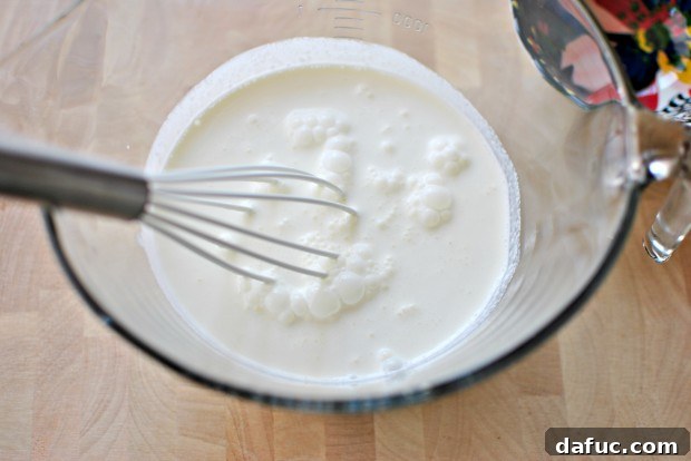 Whisking sugar and heavy cream until dissolved