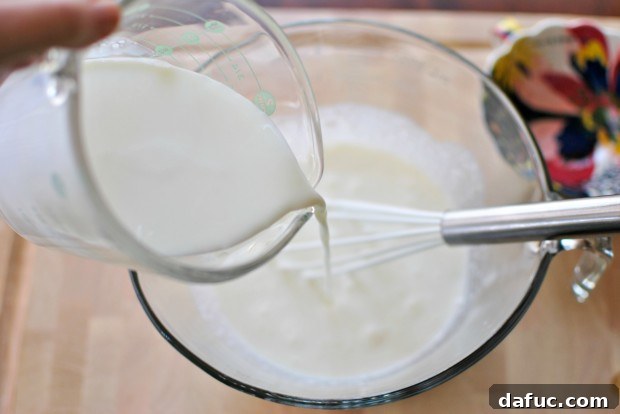 Adding whole milk to the ice cream base